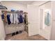 A walk-in closet featuring a storage system and access to the bathroom at 3963 Willowbrook Dr, Edgewater, FL 32141