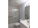 Relax in this tub and shower featuring sliding glass doors at 402 Bouchelle Dr # 205, New Smyrna Beach, FL 32169