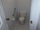 Bathroom featuring white toilet and tiled floors at 402 Bouchelle Dr # 205, New Smyrna Beach, FL 32169