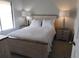 Cozy bedroom showcasing a comfortable bed, bedside tables, and neutral tones for a restful ambiance at 402 Bouchelle Dr # 205, New Smyrna Beach, FL 32169
