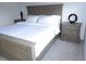 Serene bedroom featuring a plush bed, coordinating nightstands, and soft lighting for a relaxing atmosphere at 402 Bouchelle Dr # 205, New Smyrna Beach, FL 32169