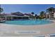 Large community pool with ample deck space and lounge chairs, perfect for relaxation and recreation at 402 Bouchelle Dr # 205, New Smyrna Beach, FL 32169