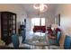 Open-concept living room with vaulted ceilings and sliding glass doors to balcony at 402 Bouchelle Dr # 205, New Smyrna Beach, FL 32169