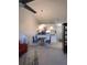 Open living area boasts vaulted ceilings, with combined kitchen, dining, and living area at 402 Bouchelle Dr # 205, New Smyrna Beach, FL 32169
