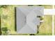 Overhead view of home roof, landscaping, waterfront backyard, driveway, and street access at 404 Central Mariners Dr, Edgewater, FL 32141