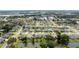 Aerial view of a quiet neighborhood featuring well-maintained homes and access to green spaces and a pond at 404 Central Mariners Dr, Edgewater, FL 32141