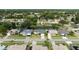 Scenic aerial view of a neighborhood with well-maintained homes and beautiful water views at 404 Central Mariners Dr, Edgewater, FL 32141