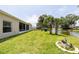 A spacious backyard with trees and water view at 404 Central Mariners Dr, Edgewater, FL 32141