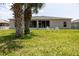 Backyard with outdoor seating with great view of the house at 404 Central Mariners Dr, Edgewater, FL 32141