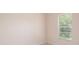 Bedroom with a window overlooking the neighborhood at 404 Central Mariners Dr, Edgewater, FL 32141