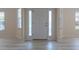 Inviting foyer featuring a front door with sidelights and views of the home's interior at 404 Central Mariners Dr, Edgewater, FL 32141
