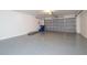 Garage features a gray epoxy floor and white walls at 404 Central Mariners Dr, Edgewater, FL 32141