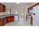 View of bright eat-in kitchen featuring stainless steel sink, updated appliances, and granite counters at 404 Central Mariners Dr, Edgewater, FL 32141