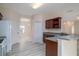 Bright kitchen features granite countertops, stainless steel sink, and wood cabinets at 404 Central Mariners Dr, Edgewater, FL 32141