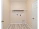 Laundry room with white walls and tile flooring at 404 Central Mariners Dr, Edgewater, FL 32141