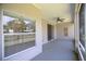 Spacious screened patio with a ceiling fan, offering a relaxing outdoor living space at 404 Central Mariners Dr, Edgewater, FL 32141
