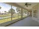 Enjoy serene water views from this screened patio, complete with ceiling fan and ample space at 404 Central Mariners Dr, Edgewater, FL 32141
