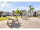 Community area with picnic tables, providing a great outdoor space for gatherings at 412 Banana Cay Dr # A, South Daytona, FL 32119