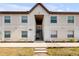 Inviting exterior of a multi-Gathering home with a well-maintained walkway and landscaped yard at 412 Banana Cay Dr # A, South Daytona, FL 32119