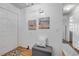 Bright hallway with laminate flooring, coastal-themed art and neutral-toned decor at 412 Banana Cay Dr # A, South Daytona, FL 32119