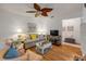 Cozy living room with hardwood floors, ceiling fan, and comfortable furniture arrangement at 412 Banana Cay Dr # A, South Daytona, FL 32119