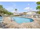 Community pool with lounge chairs and a paved patio area, ideal for relaxation at 412 Banana Cay Dr # A, South Daytona, FL 32119