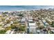 Beautiful aerial view of the neighborhood, showing proximity to the beach and highlighting the quaint streets lined with trees at 415 Jessamine Ave, New Smyrna Beach, FL 32169