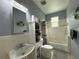 Well-maintained bathroom with a vanity, toilet, bathtub, and shower combination at 415 Jessamine Ave, New Smyrna Beach, FL 32169