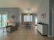 Relaxing dining area features tile flooring, bay window and decorative cabinet at 415 Jessamine Ave, New Smyrna Beach, FL 32169