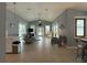 Open living room with vaulted ceilings, neutral decor, tile floors, and lots of natural light at 415 Jessamine Ave, New Smyrna Beach, FL 32169