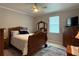 Comfortable main bedroom with a ceiling fan, natural light, and ample space for relaxation at 415 Jessamine Ave, New Smyrna Beach, FL 32169
