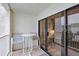 Private balcony features seating area and sliding glass doors at 4175 S Atlantic Ave # 4050, New Smyrna Beach, FL 32169