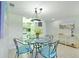 Well-lit dining area featuring a table with seating for four guests at 4175 S Atlantic Ave # 4050, New Smyrna Beach, FL 32169