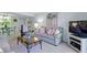 Inviting living room with comfortable sofa and entertainment unit at 4175 S Atlantic Ave # 4050, New Smyrna Beach, FL 32169