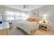Comfortable bedroom with large windows and neutral decor creating a peaceful retreat at 4175 S Atlantic Ave # 4050, New Smyrna Beach, FL 32169
