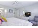 Spacious bedroom with a TV and dresser, offering a relaxing space to unwind at 4175 S Atlantic Ave # 4050, New Smyrna Beach, FL 32169