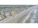 High aerial view of the property and ocean, showing beach access and nearby area at 421 S Atlantic Ave # 507, New Smyrna Beach, FL 32169