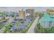 Overhead shot showing a beachfront condo with parking lot and ocean views at 421 S Atlantic Ave # 507, New Smyrna Beach, FL 32169