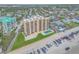 Aerial showcasing condo complex next to the ocean, featuring beach access, pool, and panoramic views at 421 S Atlantic Ave # 507, New Smyrna Beach, FL 32169