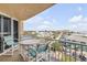 Cozy balcony set with table and chairs, perfect for enjoying the beach views and the ocean breeze at 421 S Atlantic Ave # 507, New Smyrna Beach, FL 32169