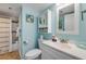 Bright bathroom features a shower and tub combination alongside a white vanity and ample storage options at 421 S Atlantic Ave # 507, New Smyrna Beach, FL 32169