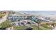 Aerial view showcasing a beachside restaurant with ample parking, capturing the lively coastal atmosphere at 421 S Atlantic Ave # 507, New Smyrna Beach, FL 32169