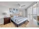 Bright bedroom with shuttered windows and stylish decor, plus a comfortable bed at 421 S Atlantic Ave # 507, New Smyrna Beach, FL 32169