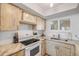 Charming kitchen with marble counters, light wood cabinetry, and updated appliances at 421 S Atlantic Ave # 507, New Smyrna Beach, FL 32169