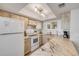 Updated kitchen with stylish light wood cabinets, marble countertops, and modern appliances at 421 S Atlantic Ave # 507, New Smyrna Beach, FL 32169