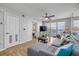 Bright living room with a sliding glass door providing access to the balcony at 421 S Atlantic Ave # 507, New Smyrna Beach, FL 32169