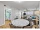 Open concept floor plan with dining table, living room area, and great ocean views at 421 S Atlantic Ave # 507, New Smyrna Beach, FL 32169