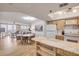 Spacious living area with an open kitchen, dining area, and comfortable seating at 421 S Atlantic Ave # 507, New Smyrna Beach, FL 32169
