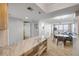 Open floor plan showcasing the kitchen, dining area, and living room with balcony access at 421 S Atlantic Ave # 507, New Smyrna Beach, FL 32169