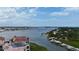Aerial view of waterfront homes, a bridge, and waterway, capturing the beautiful coastal scenery and access at 426 Bouchelle Dr # 401, New Smyrna Beach, FL 32169